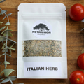 Petrichor Organics Italian Herb Seasoning Packet on a wooden surface with tomatoes and herbs.
